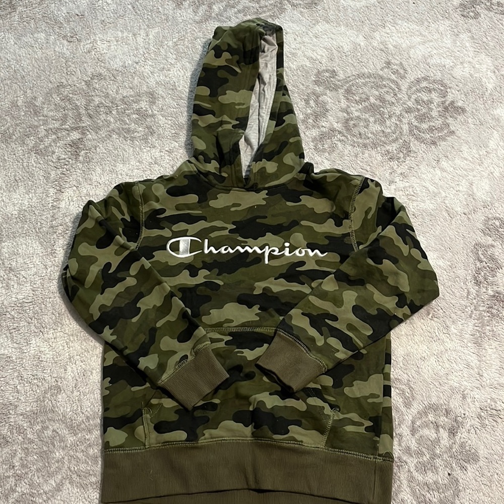 A small champions sweater